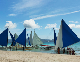 Paraw boats in Boracay Island white sand beach